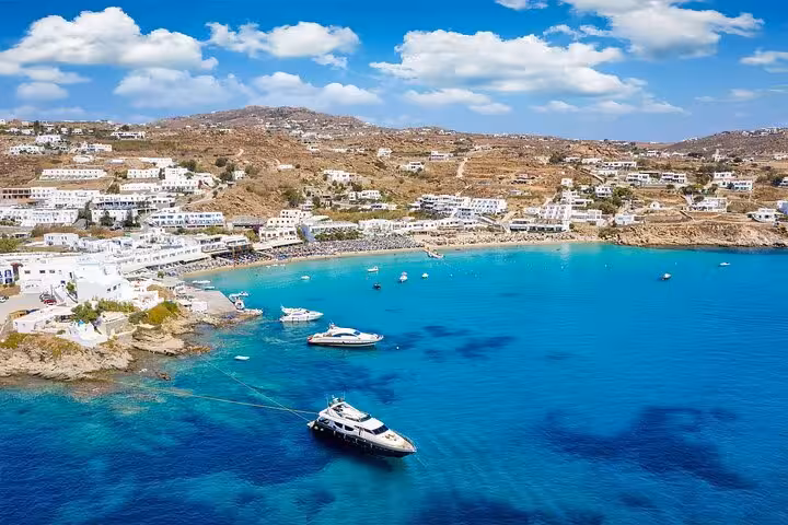 Mykonos bay with yachts and turquoise water, scenic stop on 7-day Athens Mykonos Santorini tour
