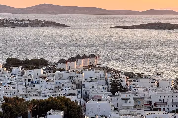 Mykonos Little Venice windmills and whitewashed houses at sunset, scenic view included in cooking class tour