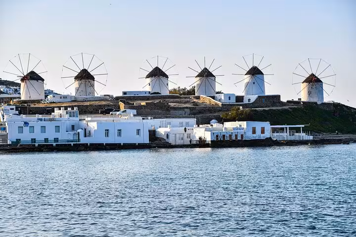 Iconic Mykonos windmills above Chora waterfront, classic photo stop on a private guided Mykonos island tour