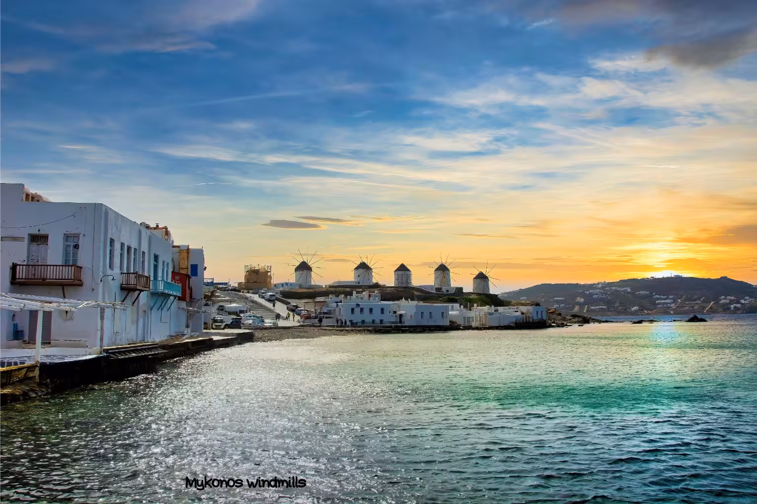 Sunset view of Mykonos windmills and Little Venice waterfront on an Athens to Santorini Naxos Mykonos island hopping tour