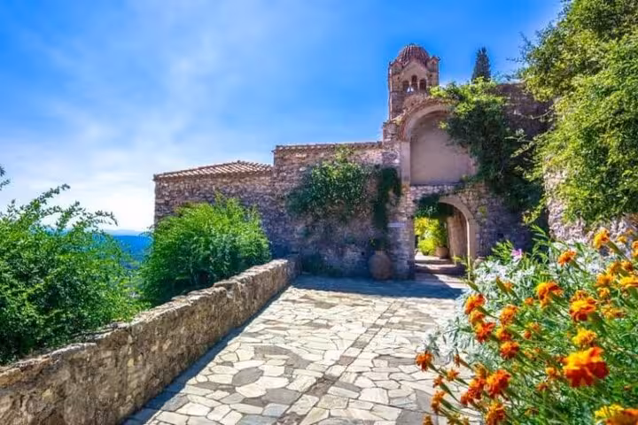 Stone pathway to Mystras Byzantine monastery ruins on a 2-day private tour from Sparta to Monemvasia