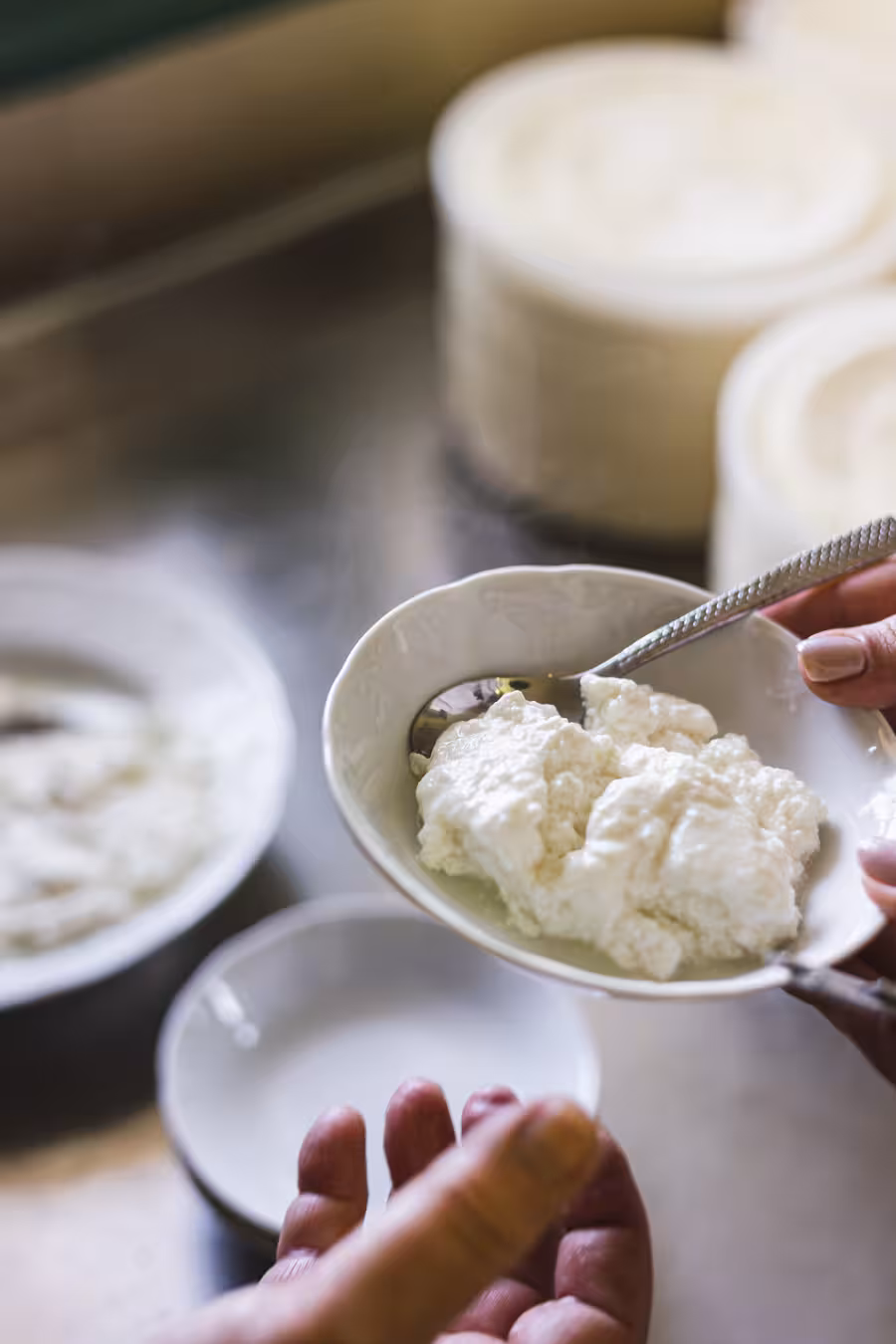 Close-up of fresh Naxos cheese being served, part of the Naxos cheese and wine trails tasting experience