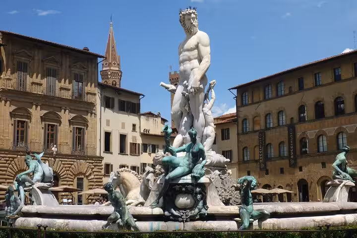 Visit the stunning Neptune Fountain in Florence's Piazza della Signoria on our Accademia and Uffizi small-group tour.