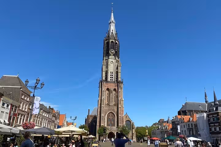 Nieuwe Kerk tower in Delft market square on a private tour from Rotterdam to Kinderdijk, Delft and The Hague