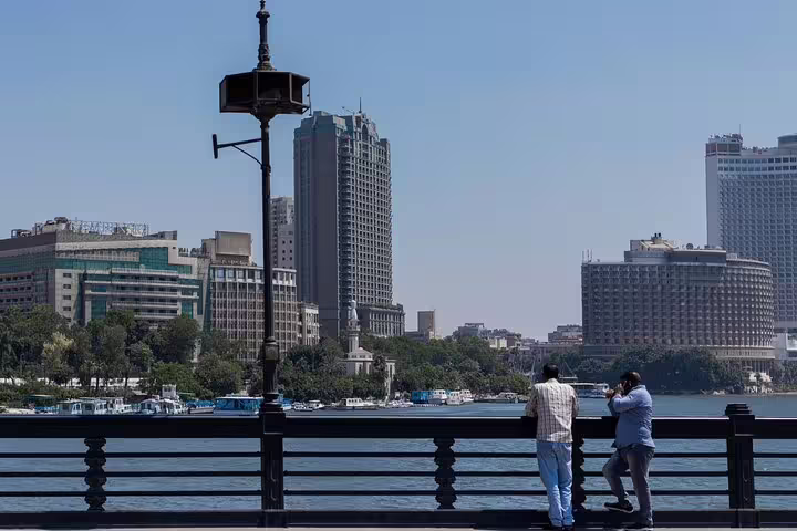Nile Corniche viewpoint with Downtown Cairo skyline, included in a half-day tour with Egyptian dinner