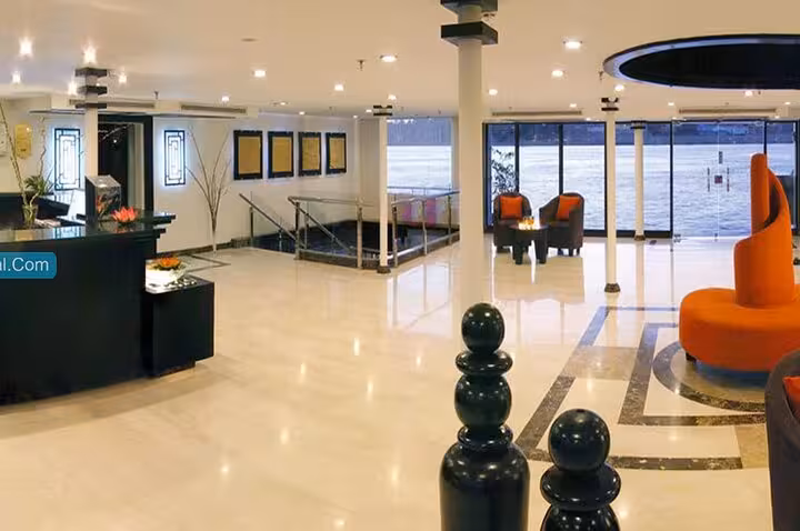 Spacious Nile cruise ship lobby with river-view windows on 6-day Aswan to Luxor cruise tour including domestic flight