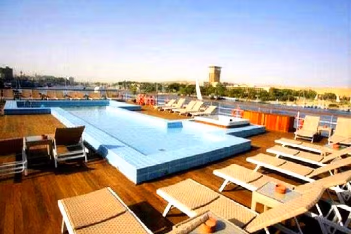 Sun deck swimming pool with loungers on luxury Nile cruise, 6-day Aswan to Luxor itinerary with flight