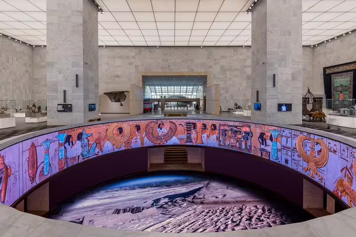 NMEC Cairo main hall with immersive pharaonic mural display, included in half day National Museum tour