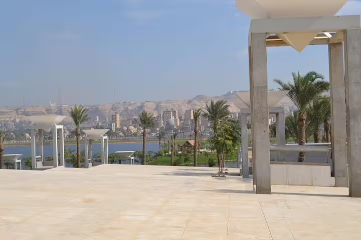 Terrace view over Fustat Lake and Cairo skyline from NMEC, scenic stop on a half day tour to Egyptian Civilization Museum