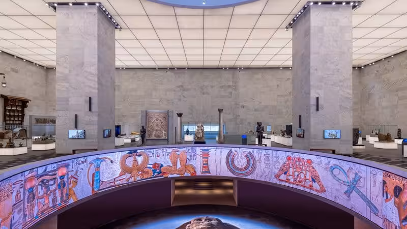 Panoramic NMEC gallery with colorful hieroglyphic mural, highlight of private Museum of Egyptian Civilization and Citadel tour