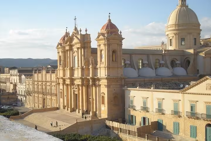 Explore the stunning Baroque architecture of Noto Cathedral on our exclusive Noto, Ragusa Ibla, and Modica tour.