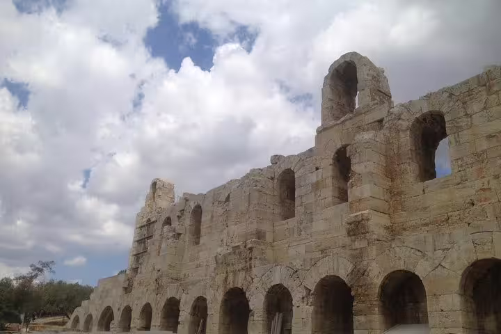 Ancient stone arches at the Odeon of Herodes Atticus in Athens, seen on a private city tour near Acropolis