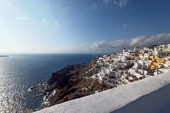 Panoramic Oia cliffside and Santorini caldera sea view, classic photo stop on iconic highlights tour