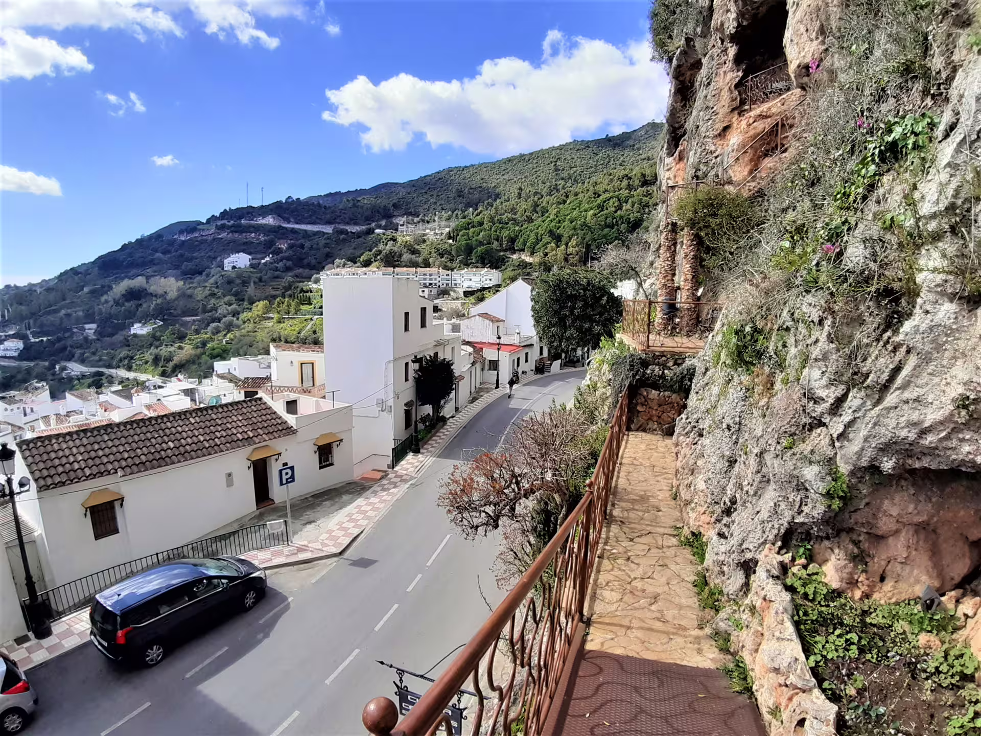 Cliffside path overlooking Ojén whitewashed village and mountain views on a private guided walking tour