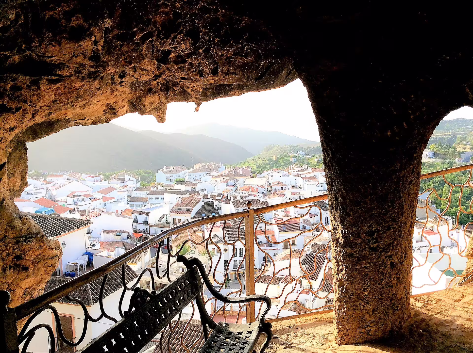 View over Ojen village rooftops from a cave lookout on a private walking tour in the Andalusian hills
