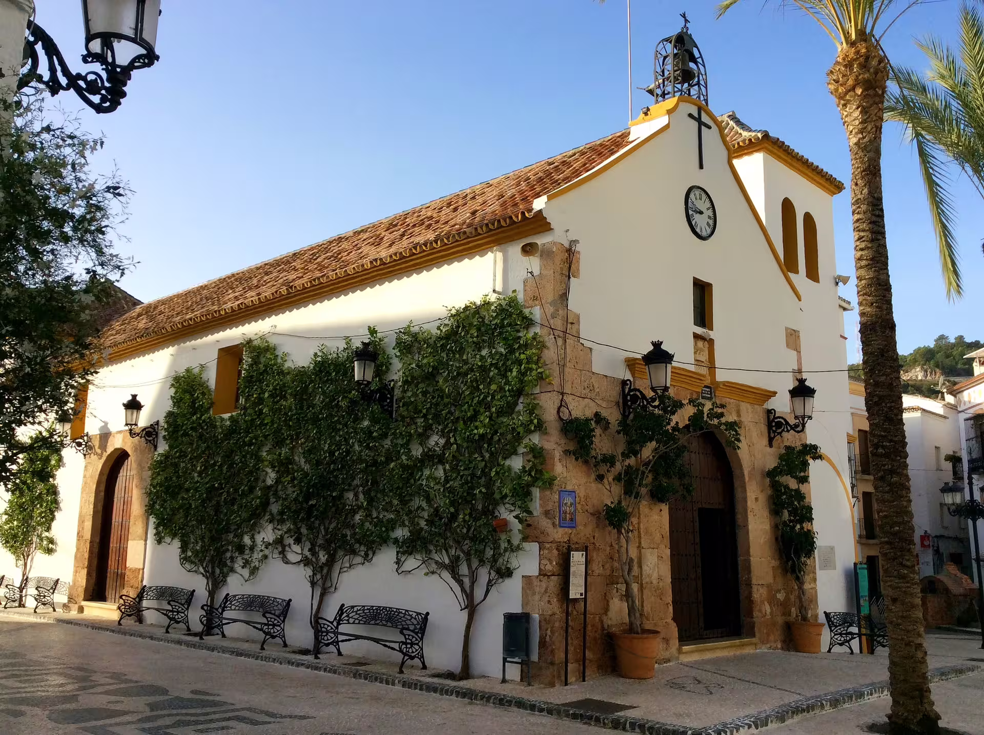 Whitewashed church in Ojen old town square, a highlight stop on an Ojen private walking tour in Andalusia