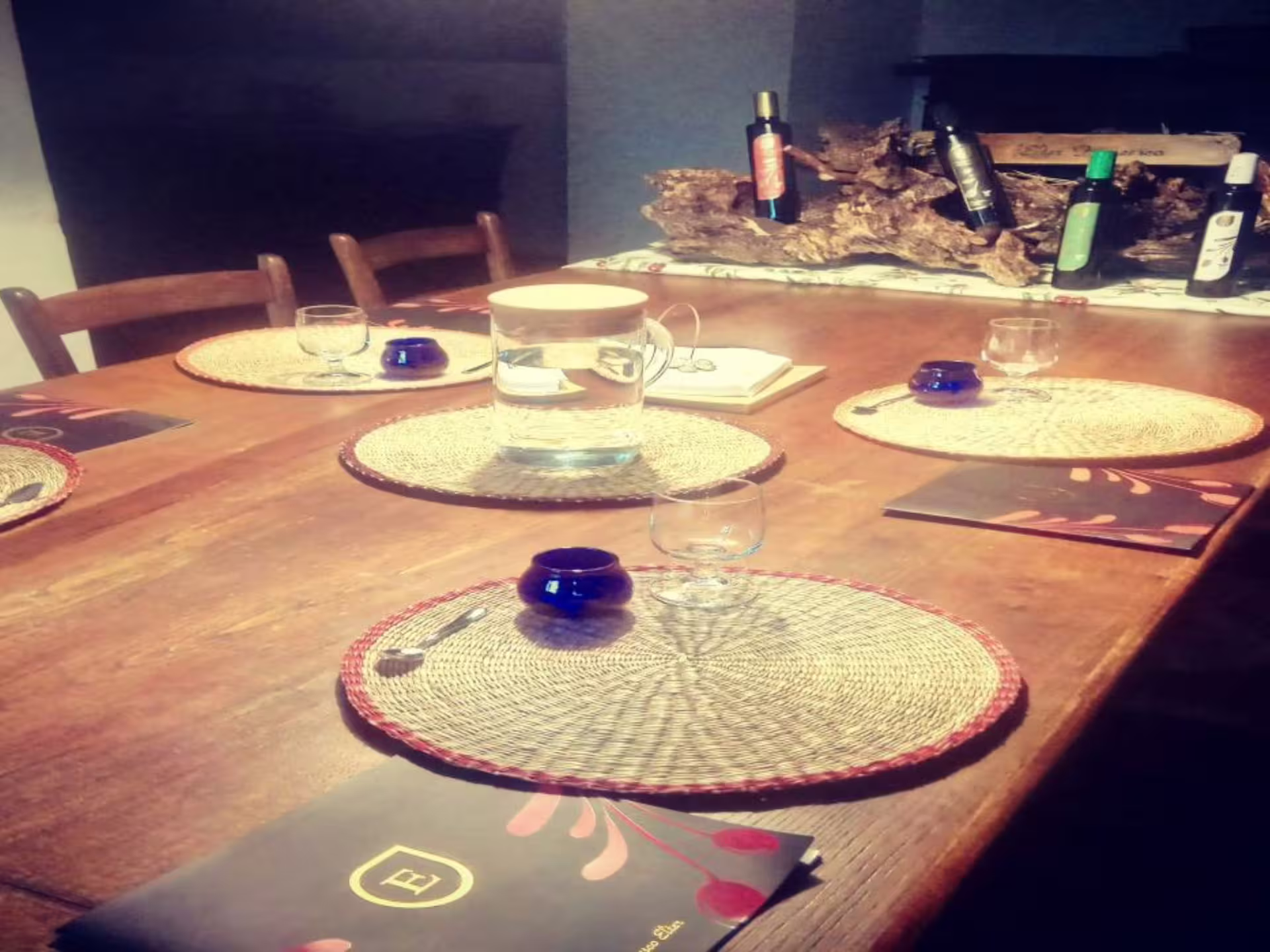 Elegant table setting for olive oil tasting with traditional decor at a Pisa olive mill tour.