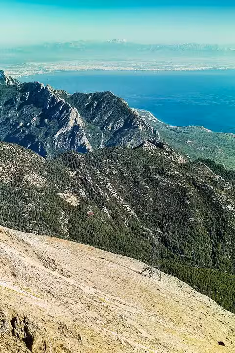 Panoramic view of Tahtali Mountain slopes and Mediterranean coast from Olympos Teleferik Antalya cable car