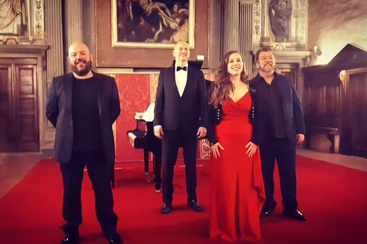 Opera singers in evening dress on red carpet for New Year's Eve Opera Gala, 31 December, in grand hall