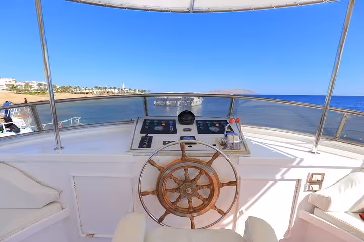 Boat helm view cruising from Hurghada to Orange Bay and Giftun Island snorkel trip with lunch on Red Sea