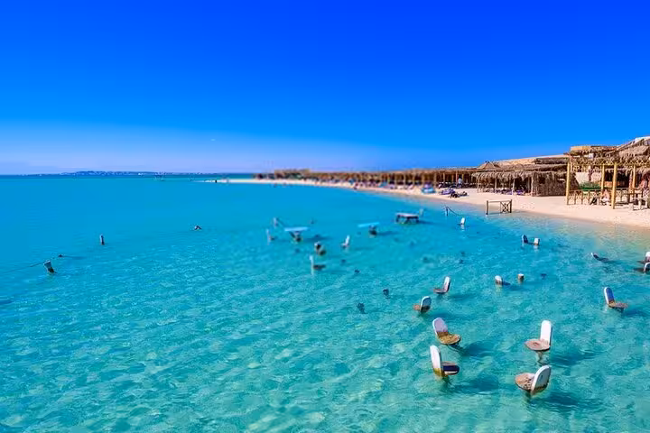 Crystal-clear Orange Bay beach near Hurghada with shallow lagoon, relaxing stop on Luxor to Red Sea snorkeling trip