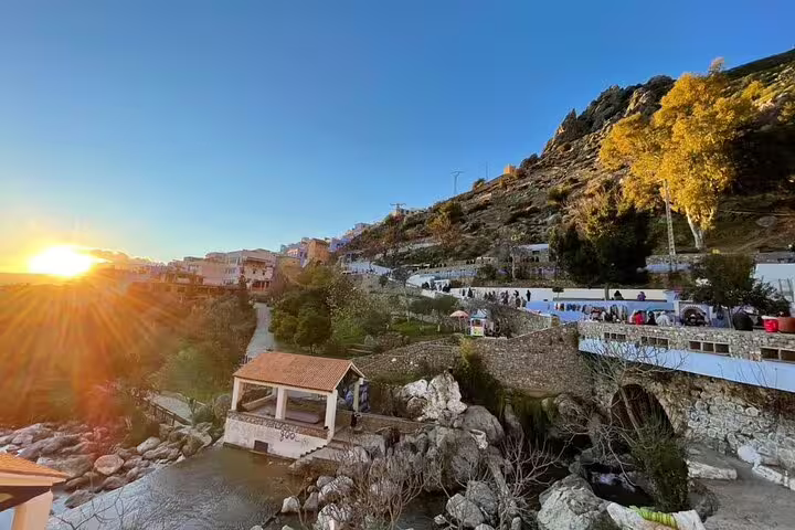 Sunset view over Ourika Valley river and hillside village near Marrakech, scenic stop on 9-day Morocco tour