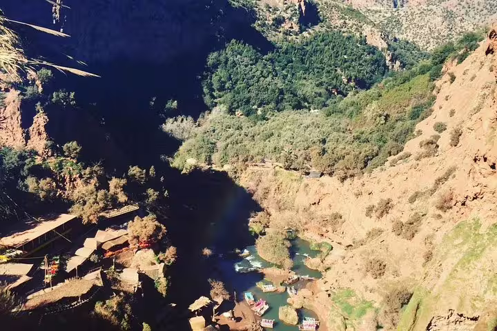 Aerial view of Ouzoud Falls valley and riverside cafes on a private Marrakech day trip to the waterfalls