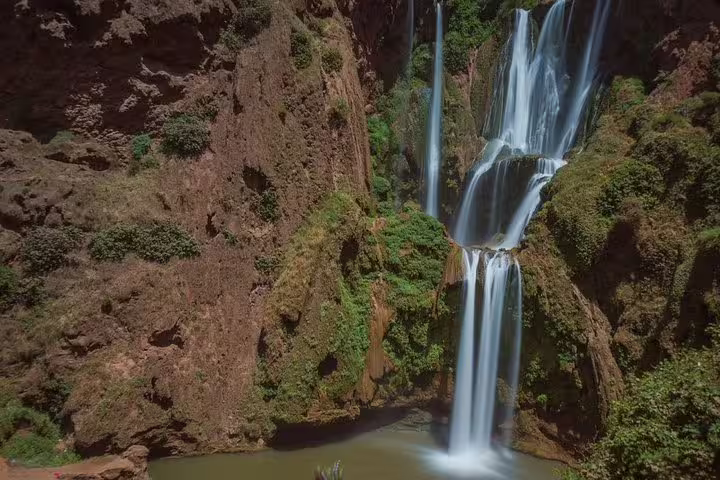 Panoramic view of Ouzoud Waterfalls plunging into a gorge on a private day trip from Marrakech, Morocco