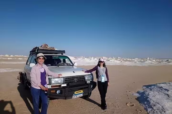 Travelers by 4x4 in Egypt’s White Desert near Bahariya Oasis, start of overnight camping safari tour