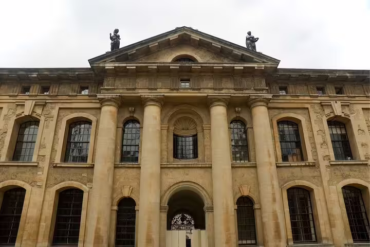 Grand neoclassical Oxford building facade with columns, featured on Oxford scavenger hunt self-guided tour