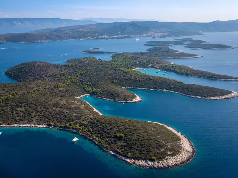 Aerial of Pakleni Islands turquoise coves near Hvar, cruising route on Vis and Hvar boat tour with Blue Cave