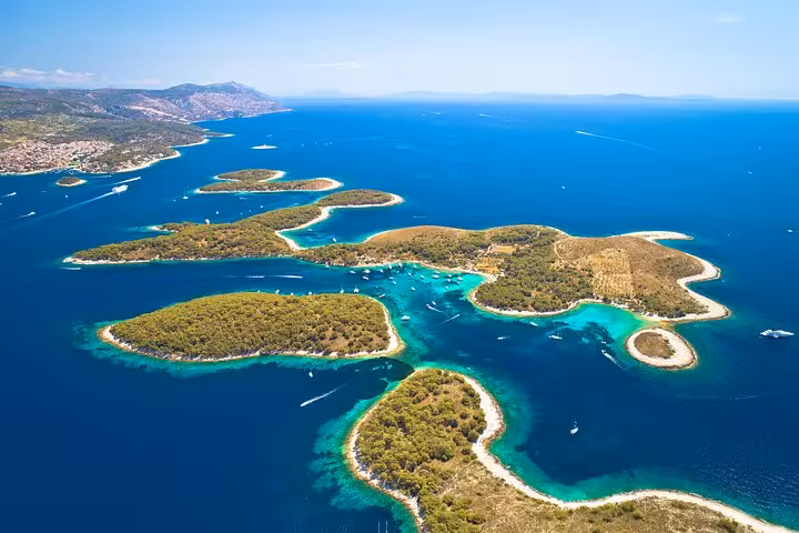 Aerial view of Pakleni Islands turquoise lagoons near Hvar, scenic stop on Blue Cave and Vis speedboat tour