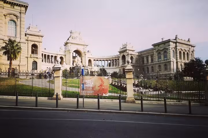 Palais Longchamp in Marseille with fountains and arches, featured on private full-day shore excursion tour
