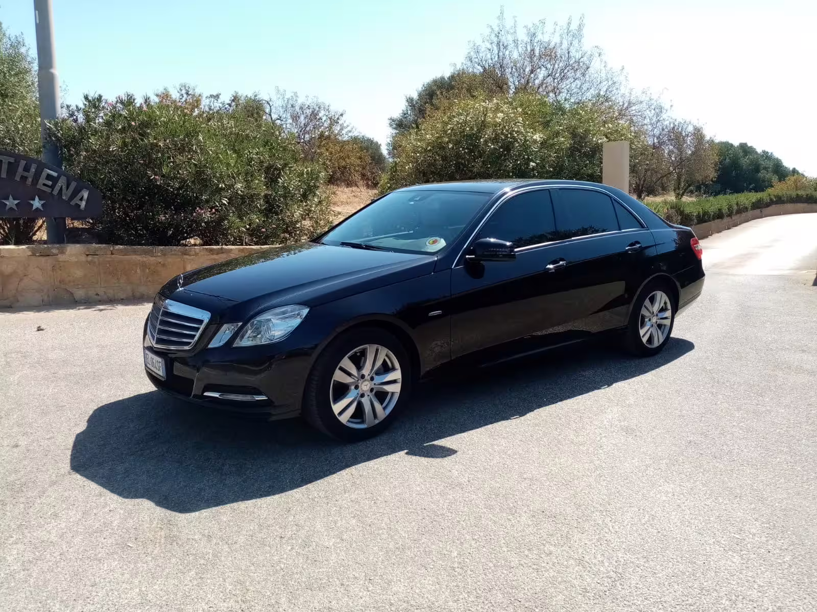 Executive black Mercedes sedan ready for private transfer from Palermo airport to Villa Igiea Rocco Forte hotel