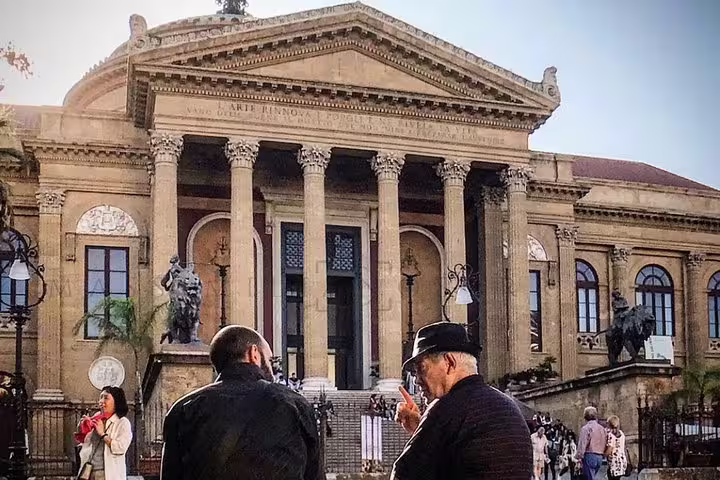 Travelers gathered outside Palermo’s historic Teatro Massimo, end point of private transfer to nearby Massimo Plaza Hotel