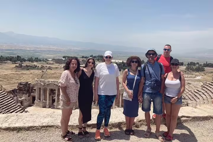 A group enjoys panoramic views of the ancient ruins in Hierapolis on a Pamukkale tour from Izmir.