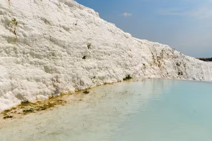 Turquoise thermal water beside Pamukkale travertine wall on an all-inclusive private guided tour, Denizli Turkey