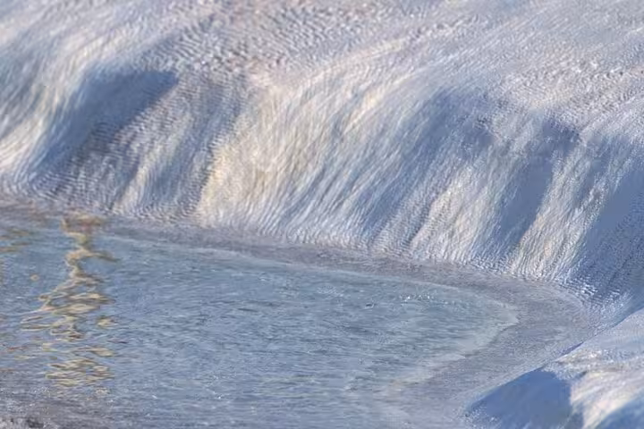 Close-up of Pamukkale travertine pool with clear thermal water, highlight of an all-inclusive private guided tour