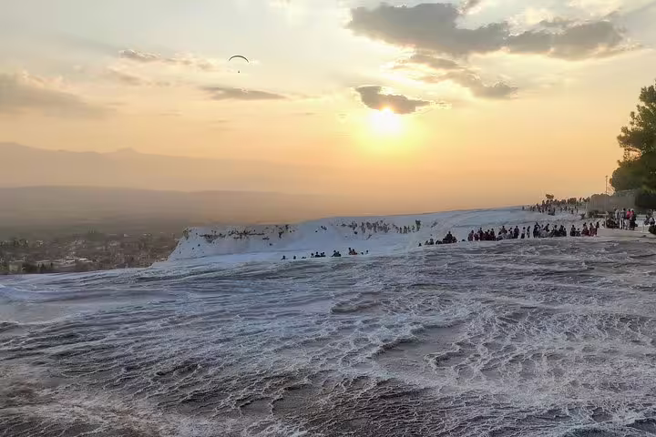Sunset over Pamukkale travertine terraces, scenic stop on 8-day Istanbul Cappadocia Ephesus tour