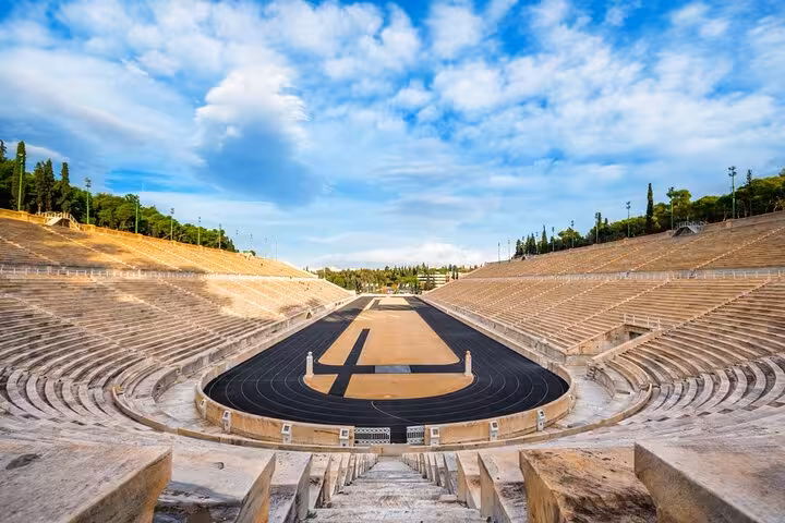 Panathenaic Stadium in Athens on a small group panoramic tour, marble seats and track under blue skies