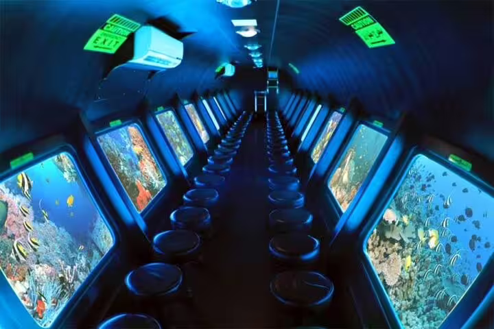 Panorama semi submarine cabin in Hurghada with large windows viewing Red Sea coral reef and tropical fish