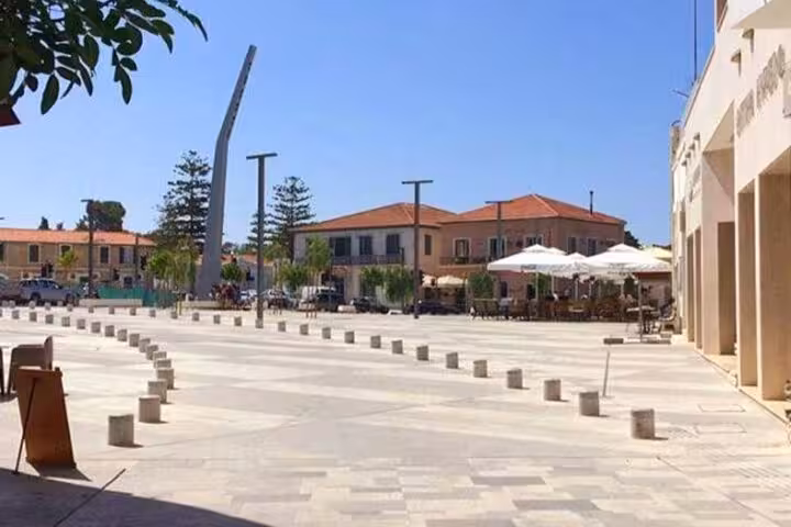 Paphos old town square meeting point for half day tour with hotel pickup bus and local cafes in Cyprus