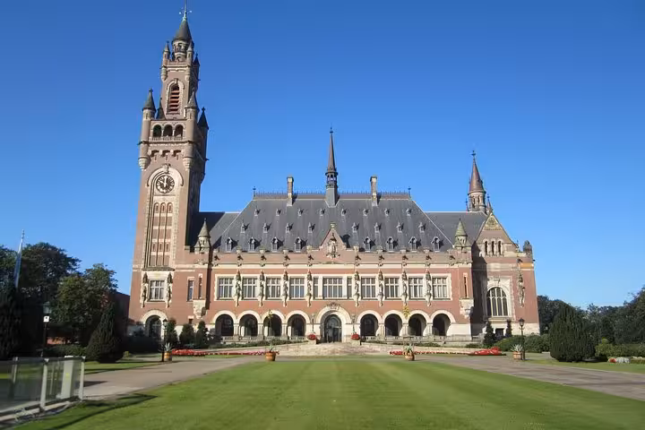 Peace Palace in The Hague with manicured lawns, featured on private day trip from Amsterdam to Rotterdam and Delft