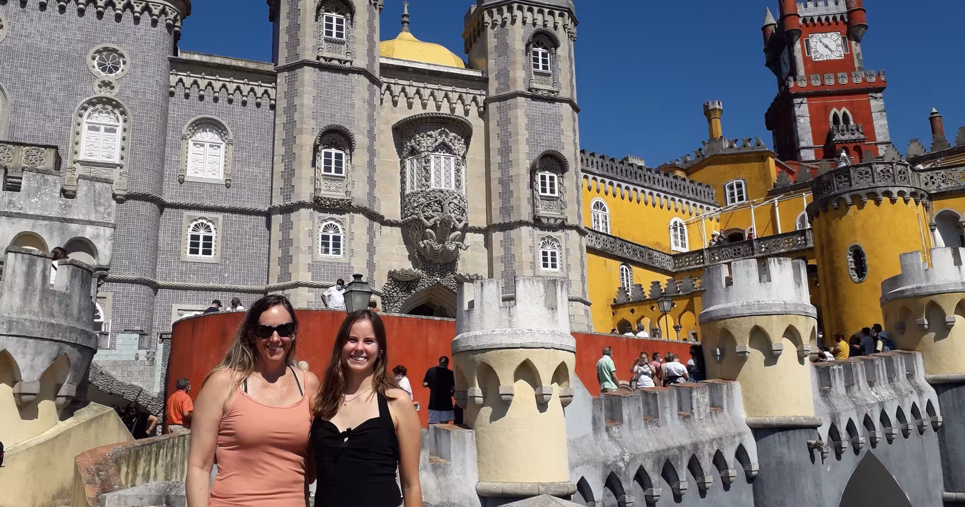Visitors at Pena Palace in Sintra, a highlight of the Lisbon & Sintra full-day historical tour in Portugal