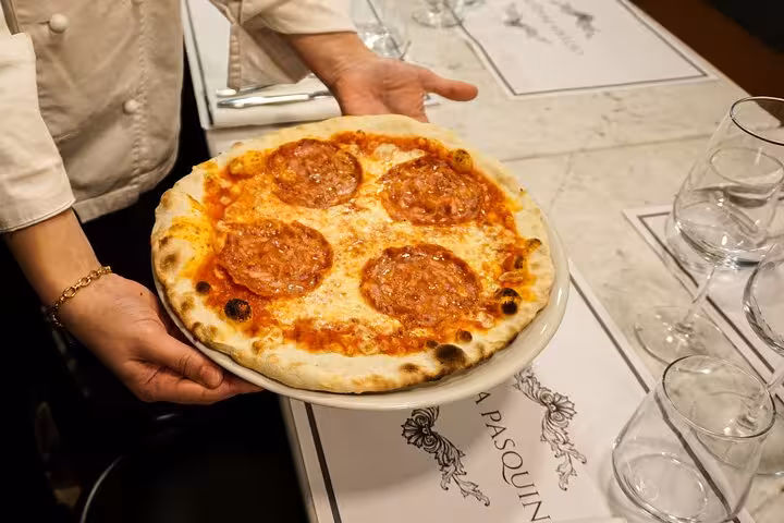 Close-up of a freshly made pepperoni pizza from a cooking class near Piazza Navona in Rome.