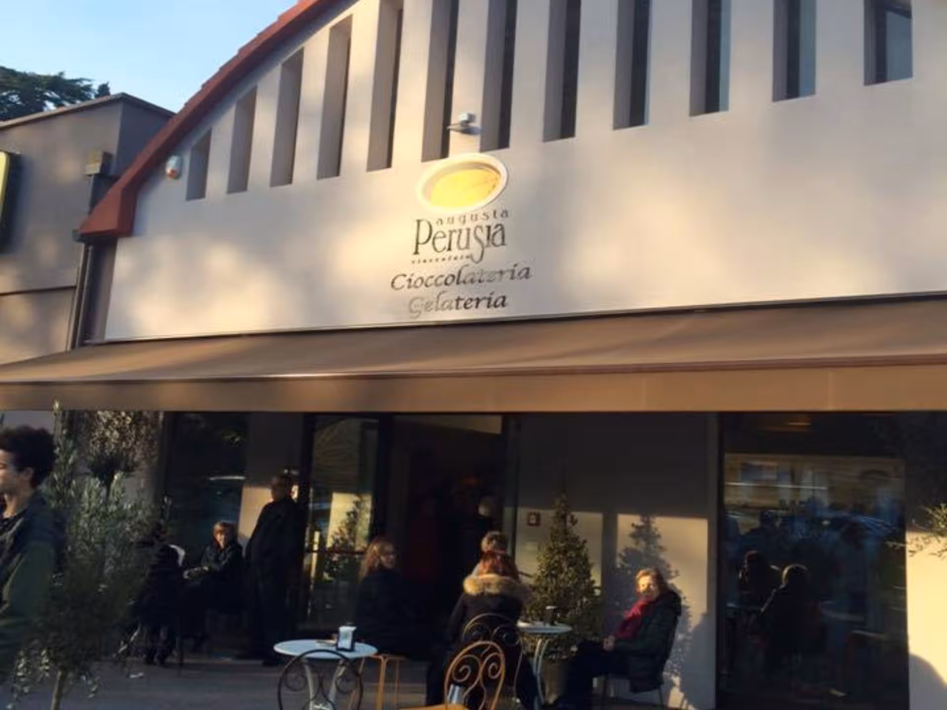 Outdoor seating at a Perugia chocolate factory, perfect for a relaxing break on the Chocolate Factory Tour and Tasting.