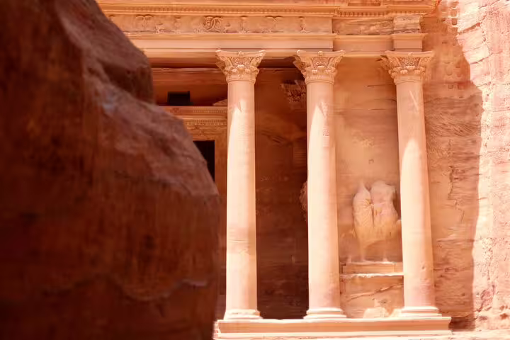 Close-up of Petra’s Royal Tomb columns in rose sandstone, a highlight on the Petra tour from Taba by ferry