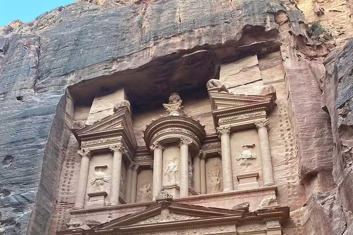 Petra Treasury Al-Khazneh carved in rose-red cliffs, highlight of Egypt Jordan tour from Cairo to Amman