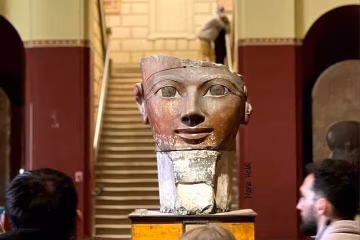 Colossal pharaoh head sculpture displayed in the Grand Egyptian Museum, VIP Giza Pyramids day tour in Cairo