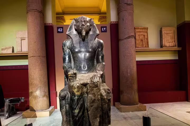 Seated pharaoh statue in the Egyptian Museum Cairo gallery, featured on a 4-hour private tour